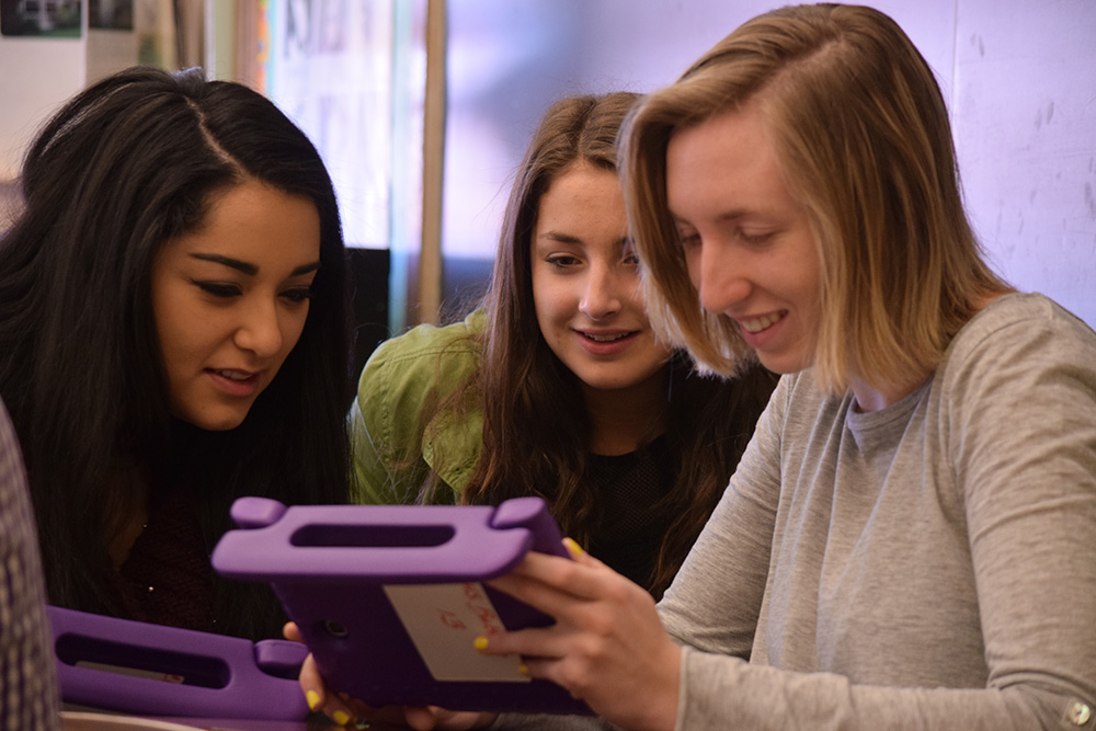 Students working together in a classroom.